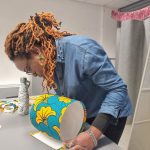 Owner Kala demonstrating how to make a lampshade