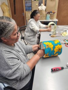Two women making lampshades