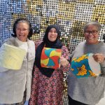 Three ladies showing their handmade lampshades