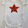 white bodysuit with orange star applique