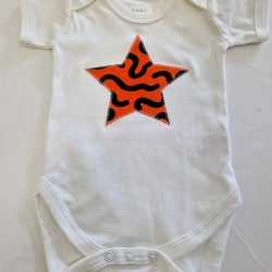 white bodysuit with orange star applique
