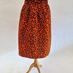 orange skirt with black squiggles