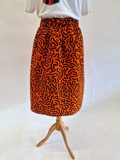 orange skirt with black squiggles