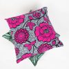 A stack of two brightly coloured cushions