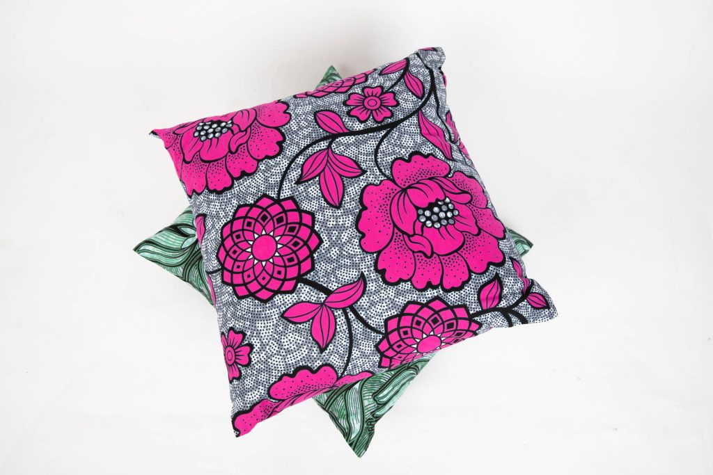 A stack of two brightly coloured cushions